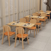Canapé et table de restaurant avec chaises en cuir et en bois massif, ensemble moderne rembourré pour hôtel et centre commercial