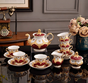 Juego de Té Completo de Porcelana China con Relieve Floral Rojo y Dorado, con Tetera, Tazas, Azucarera y Cremajera, Estilo Barroco - Product Image 1