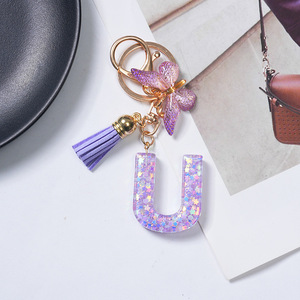 Llavero <span class=keywords><strong>de</strong></span> resina morada con letras del alfabeto, colgante para bolso, 26 letras inglesas, borla morada, mariposa, llavero con inicial - Product Image 6
