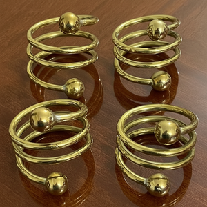 Handmade <b>engraved</b> floral metal napkin ring with vintage polish for rustic inspired decor at events or dinner gatherings - Product Image 1