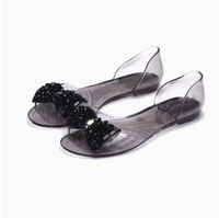 Nouvelles sandales transparentes pour femmes, chaussures plates d'été en gelée, chaussures à nœud en diamant de verre, chaussures à bouche de poisson en plastique, chaussures tendance