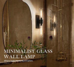Lámpara de pared para baño, con pantalla de cristal cilíndrica transparente y metal negro, para uso residencial y hotelero, montaje en pared interior. - Product Image 1