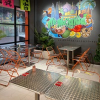 Meubles de restaurant thaïlandais modernes, table à manger à motifs avec chaises pliantes en acrylique pour bistro d'Asie du Sud-Est