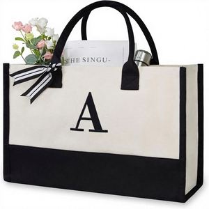 กระเป๋าถือทรงโท้ทพร้อมส่ง ขนาดใหญ่ จุของได้เยอะ ผ้าแคนวาสหนาเคลือบอย่างดี ดีไซน์ต่อผ้าเก๋ไก๋ทันสมัย - Product Image 1