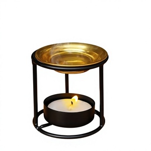 Brûleur d'encens et diffuseur d'arômes religieux essentiels en laiton rond sur support en fer au design épuré, finition noire, pour la décoration intérieure - Product Image 1