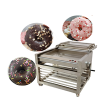 Machine à glaçage et enrobage pour beignets, pâtisseries et desserts, idéale pour les boulangeries, avec options chocolat, sucre et crème