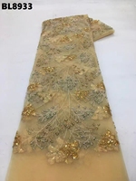 Tissu en dentelle perlée de Lettonie de couleur blanche avec broderie et paillettes pour robes de mariage et de soirée