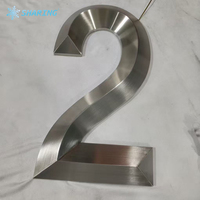 Enseigne personnalisée en lettres 3D en acier inoxydable chromé miroir rétroéclairées par LED pour la façade de magasin