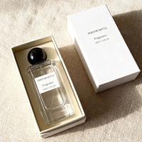 Vente en gros de flacons de parfum en verre givré personnalisés de 100 ml, couleur personnalisée, bouchon sphérique doré de luxe, vaporisateur portable rechargeable pour les voyages