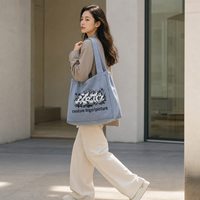 Sac fourre-tout en toile coloré et tendance avec motifs graffiti, renforcé pour ordinateur portable, idéal pour le travail et les trajets quotidiens, personnalisable ODM OEM