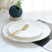 Jingchen Ensemble d'assiettes en porcelaine céramique blanche à bordure dorée de luxe Plats en porcelaine fine et assiettes écologiques quantité minimale de commande 100 pièces