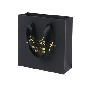 Commercio all'ingrosso Logo flessografia di lusso Kraft al dettaglio di carta Tote Bag sacchetto della spesa di carta regalo sacchetto con manico