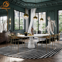 Mesa de Comedor de Estilo Moderno: Tablero Ovalado de Mármol, Base Única Tipo Columna, que Agrega Elegancia a los Espacios de Comedor Contemporáneos