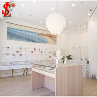 Comptoir de magasin de bijoux en verre moderne avec éclairage LED, solutions d'affichage intérieur personnalisables pour les magasins de bijoux