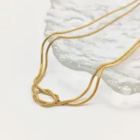 Collier pour femme EMANCO minimaliste et élégant en acier inoxydable plaqué or 14 carats avec chaîne en corde et pendentif nœud pour fiançailles