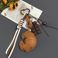 Porte-clés en cuir avec breloque sac, motif pain et chocolat, style simple et circulaire