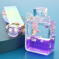 Porte-clés Créatif en Forme de Sirène Flottante dans un Flacon de Parfum Liquide Huileux Quicksand
