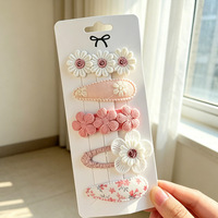 Ensemble de pinces à cheveux en tissu doux et antidérapant avec motifs de fleurs mignonnes pour petites filles, idéal pour les fêtes et l'usage quotidien