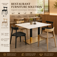 Ensemble de salle à manger, surface en pierre frittée blanche avec colonne à revêtement noir et doré, idéal pour les cafés, restaurants, zones alimentaires et salles de jeux modernes