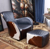 Fauteuil de salon individuel en cuir de vachette style rétro industriel, type selle de cheval, en chêne, pour une relaxation optimale