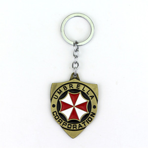 Nuevas llegadas Resident <span class=keywords><strong>Evil</strong></span> llaveros de metal al por mayor paraguas coche llavero película Logo llavero promocional Accesorios - Product Image 3