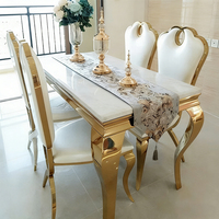 Table à manger en marbre italien avec base en acier inoxydable doré, design moderne pour la maison, l'appartement ou la restauration