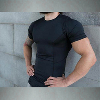 Nuevo mono de fitness para hombre, camiseta de manga de corte elástico de secado rápido, ropa de entrenamiento de alta elasticidad con cuello redondo, estilo Formal
