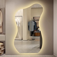 Miroir mural ondulé avec éclairage LED rétroéclairé, design moderne sans cadre pour chambre, salon, entrée, vente en gros