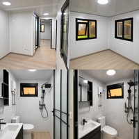 Maison conteneur pliable extensible en pierre empilée artificielle avec cadre foncé et fenêtres coulissantes pour le glamping en terrain aride