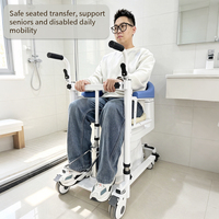 Chaise élévatrice hydraulique bleu foncé pour transfert de patients avec accoudoirs et fonction toilette intégrée pour soins aux personnes âgées