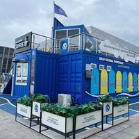 Boutique de vente au détail modulaire en conteneur maritime à deux étages, avec structure en acier, couleurs personnalisables, fenêtres en verre et écran LED