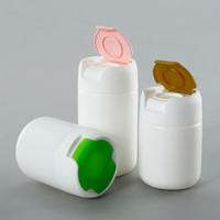 Bouteilles rondes en plastique HDPE à marque privée 120CC 150CC 200CC, conteneur de capsules de qualité alimentaire avec bouchon à clapet pour vitamines et suppléments nutritionnels