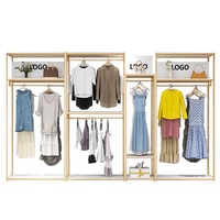 Porte-vêtements mural modulaire en métal noir et or de luxe pour boutique de robes de mariée et magasin de détail