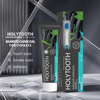 Vente en gros personnalisée Holytooth Noix de coco blanchissant menthe fraîche à base de plantes 130g dentifrice avec brosse à dents pour un usage domestique taille normale