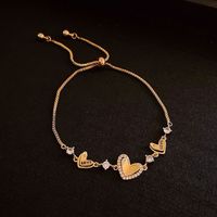 Bracelet coulissant en fer avec fleur en zircon de style coréen, luxe léger, sophistiqué, doux, frais, élégant et polyvalent, vente en gros