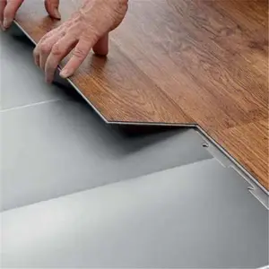 Plancher en bois commercial flottant vinyle pas cher planche de PVC imperméable Spc plancher rigide 5mm/0.5 clic couleur en bois d'intérieur moderne
