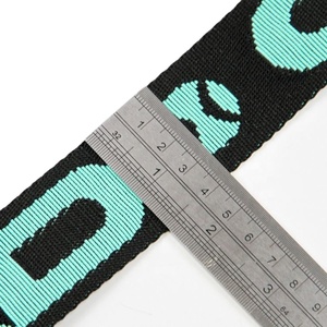 สายรัดกระเป๋าเป้ PP Webbing Tape ทำจากโพลีโพรพิลีน 100%  ลายโลโก้แบบ Jacquard ขนาด 25 มม. สีดำ หนา 2 มม. - Product Image 2