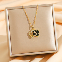 Collier en acier inoxydable de luxe à double couche noir et blanc avec zircon et trèfle à quatre feuilles pour femmes et filles, élégant et haut de gamme