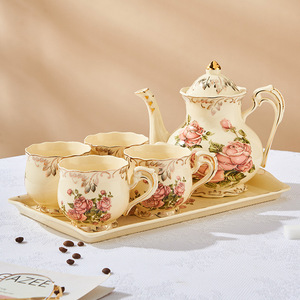 Service à thé en porcelaine rose ivoire vintage avec théière, motif floral, idéal pour un cadeau - Product Image 1