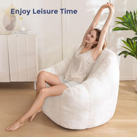 Fauteuil pouf ergonomique pliable moderne en polyester pelucheux beige, idéal pour la photographie, avec mousse de bonne qualité
