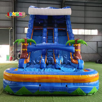 Toboggan aquatique gonflable commercial en promotion, toboggan aquatique double piste avec palmiers tropicaux pour fêtes d'enfants