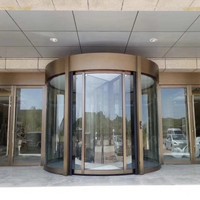 Porte tournante moderne à deux ailes en verre pour supermarchés et bâtiments d'entreprise avec commande manuelle et design de colonne annulaire en verre intelligent