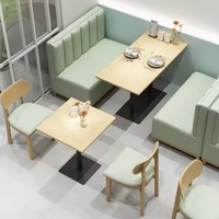 Sofa de cabine de table et de chaise simple personnalisé Ensembles de restaurant occidental pour cafés et salle à manger Combinaison de canapé de cabine murale