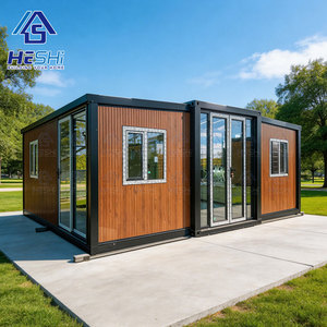 บ้านสำเร็จรูป HESHI สไตล์โมเดิร์นหรูหรา ขนาด 20 ฟุต/40 ฟุต แบบขยายได้ ใช้เป็นสำนักงาน ห้องนอน รูปทรงสี่เหลี่ยมผืนผ้า พร้อมประตูกระจกและตกแต่งด้วยไม้ - Product Image 1