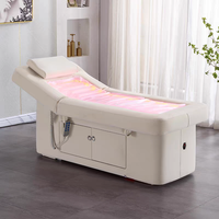 Table de massage électrique moderne personnalisée avec revêtement en cuir PU et fonction chauffante pour les soins de spa en hôtel