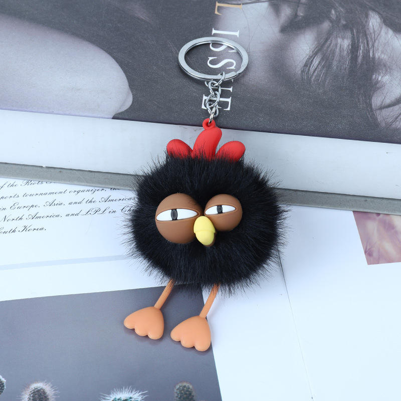 Petit coq noir qui fait un clin d'œil