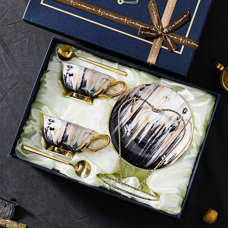 Two cups and saucers spoon with rack gift box