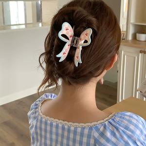 Ventes chaudes : Accessoires pour cheveux en plastique mignons et doux, pinces à cheveux en forme de nœud de couleur bonbon pour les occasions festives - Product Image 2