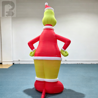 Mascotte gonflable personnalisée du Grinch avec chapeau de Père Noël pour la décoration de l'ambiance de fête de Noël communautaire
