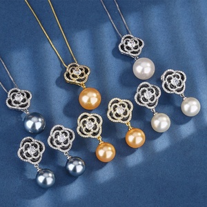 Fashion Jewelry Eco-friendly Copper 16-14MM Shell Pearl Camellia Flower Design Temperament Pendant and Earrings Set for Women - Product Image 1